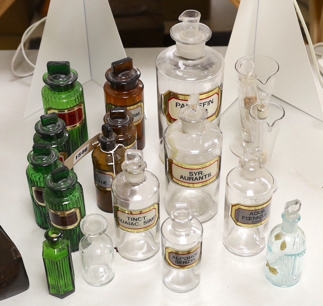 A collection of apothecary bottles, two measures and files, tallest bottle 27cms high